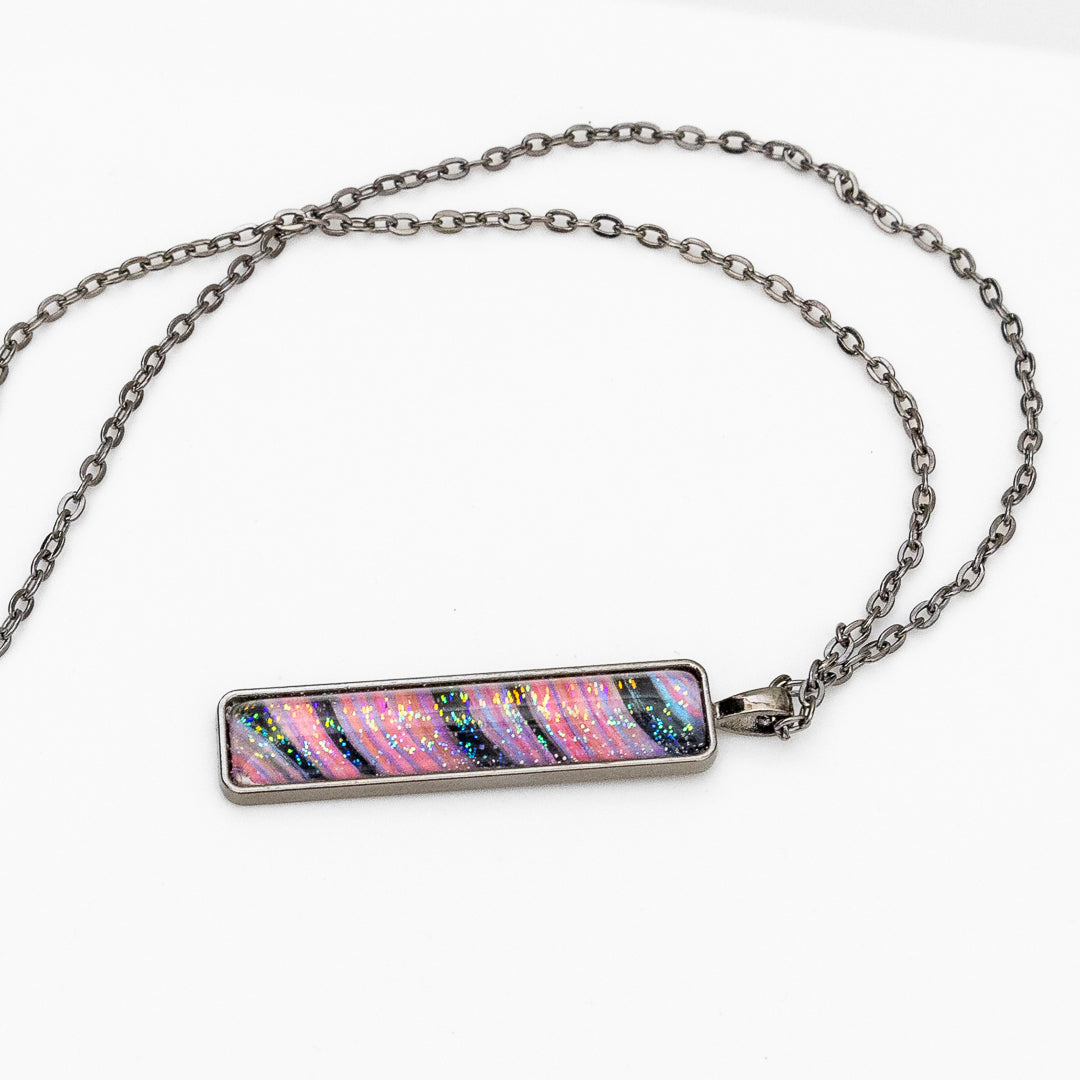 Pink and Black Swirl with Iridescent Sparkles Pendant on Gunmetal Chain